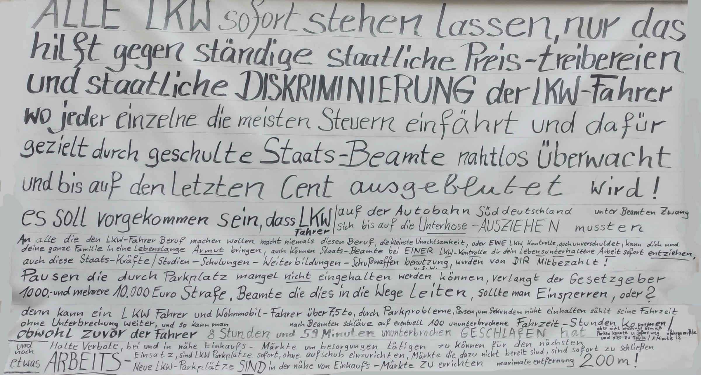 Handgeschriebenes Plakat: Alle LKW sofort stehen lassen